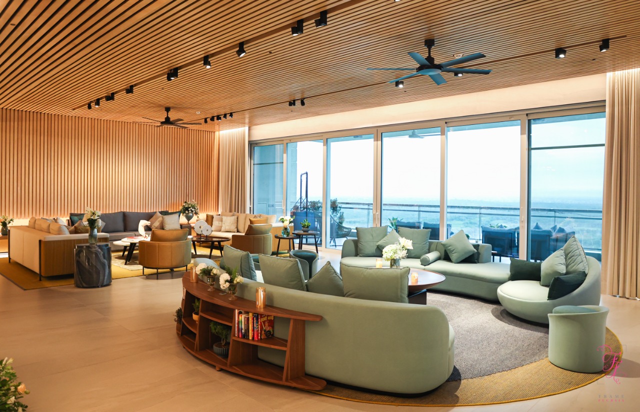 Large living area with timber slat ceiling and track lighting designed by Synoda Lighting